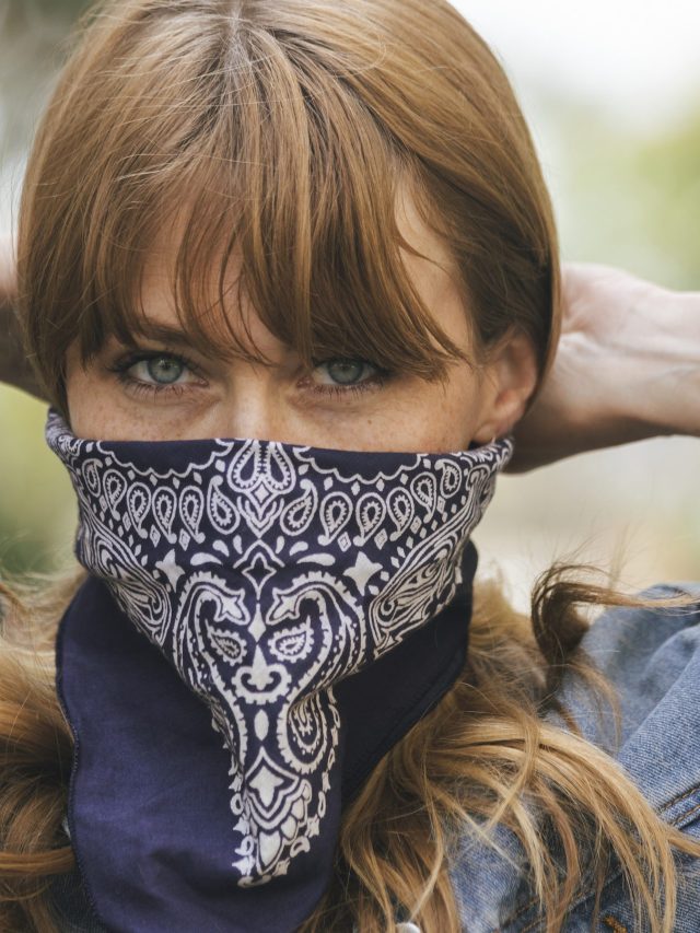 Woman using a scarf as a face mask during coronavirus outbreak