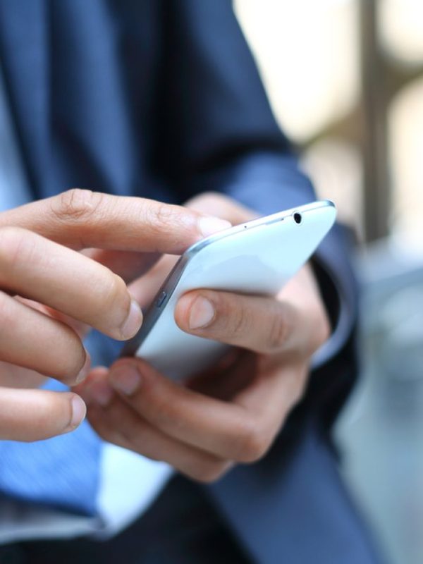 Close,Up,Of,A,Man,Using,Mobile,Smart,Phone