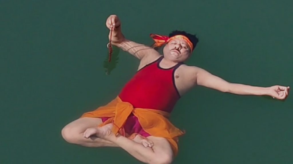 Bhagwan Das doing yoga in water