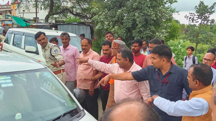 Minister Rakesh Shukla engaged in providing "life saving" to the "seriously injured person" in a road accident.