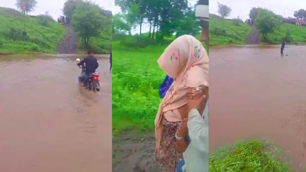 Pregnant woman crossing a swollen drain