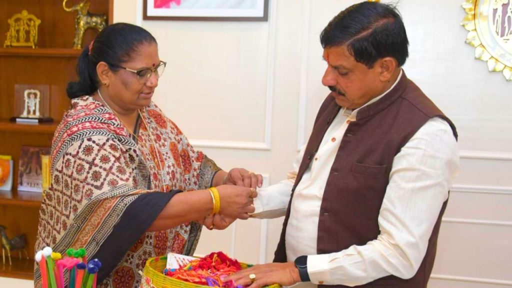 Women and Child Development Minister Nirmala Bhuria tying Rakhi to CM Mohan Yadav.