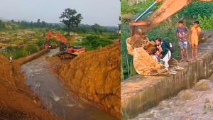 Singrauli, school children were made to cross the drain by sitting in the boom bucket of Poklane Machine (PC).