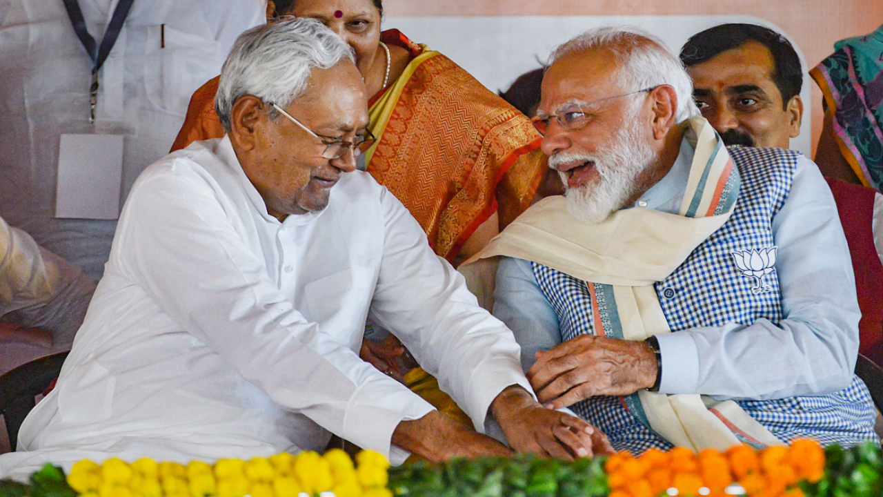 Nitish Kumar tries to touch PM's feet at Bihar event.