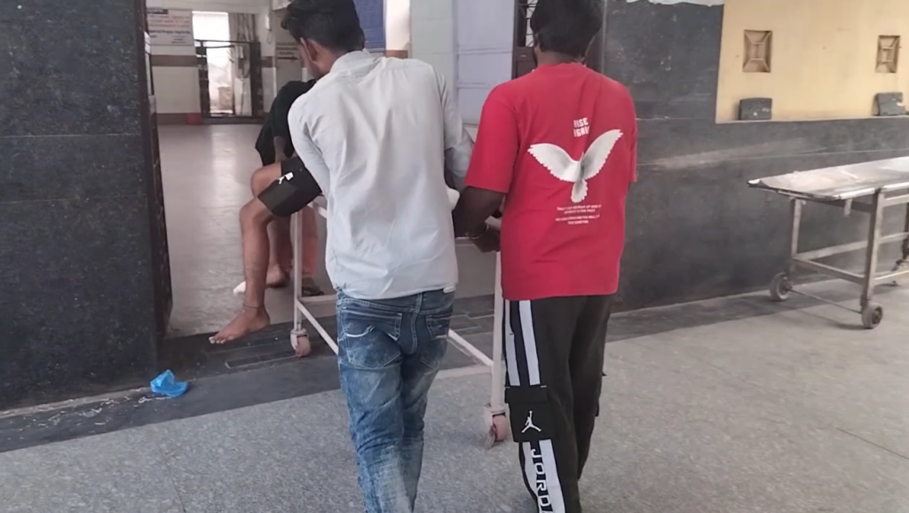 Relatives carrying patients outside a hospital after a fire broke out.