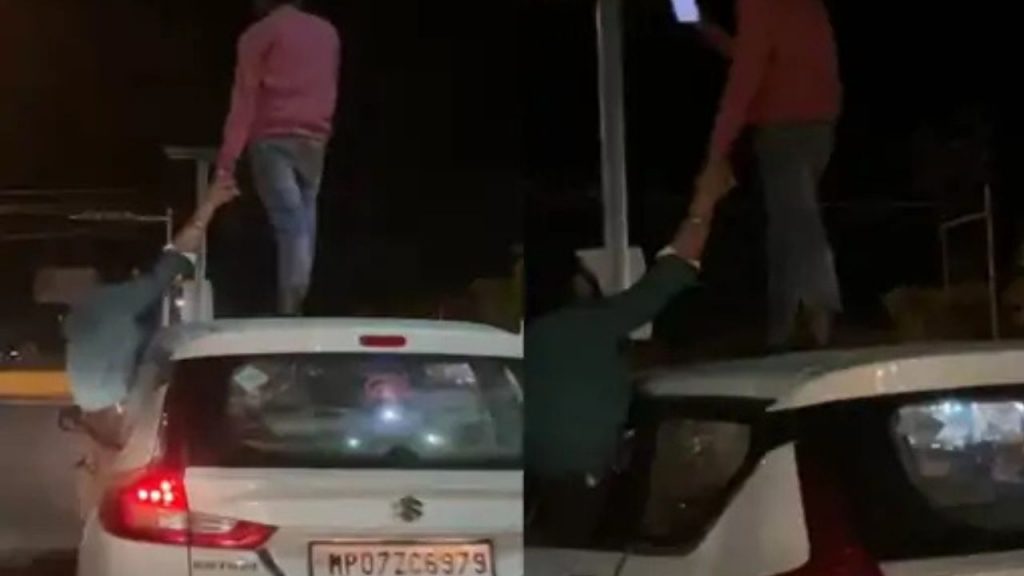 Stunt performance in a moving car in Gwalior.
