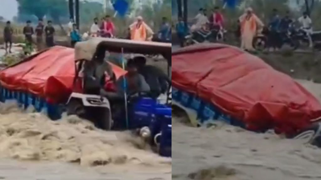A tractor trolley overturned in the middle of an overflowing drain in Shivpuri.