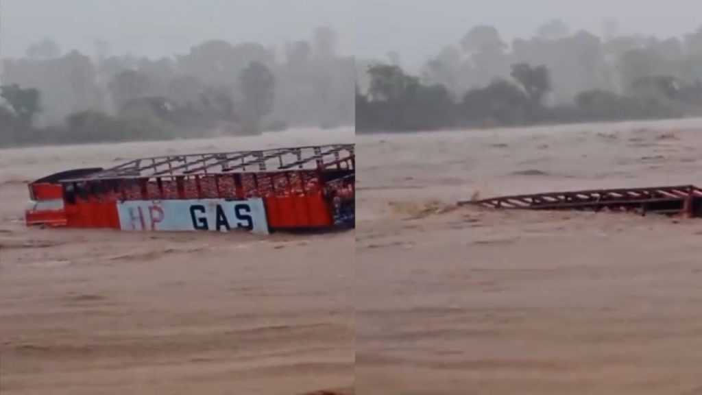 A truck loaded with gas cylinders was swept away into a river in Jabalpur.