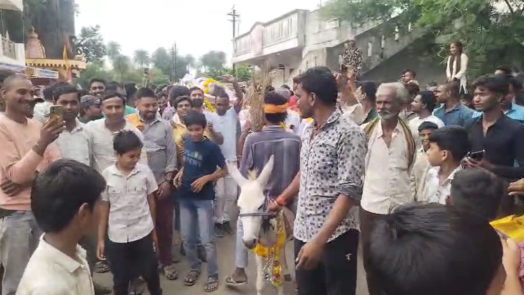 To bring rain in Dhar, a living person was laid on his death bed and was taken around upside down on a donkey.