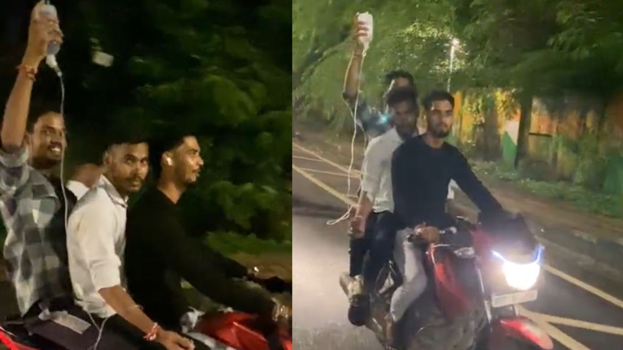 A young man on a drip roaming the city on a bike