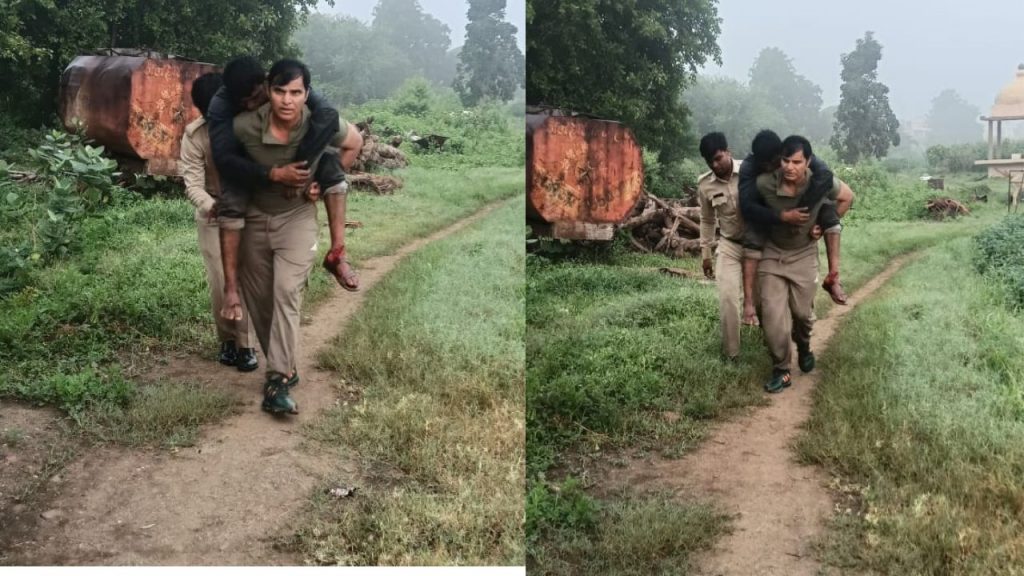 TI walking carrying the injured person on his back.