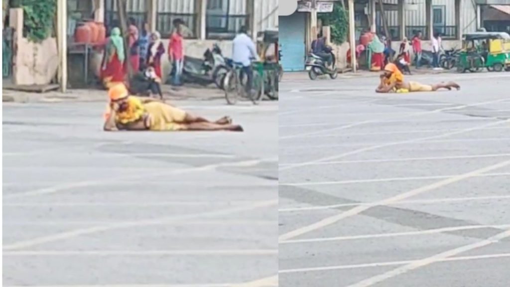 A person did yoga in the middle of the intersection in Indore.
