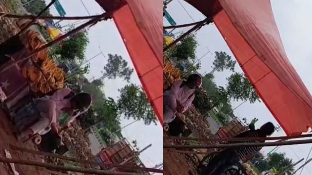 One person spit in the bottle and then another person sprinkled water on the fruits.