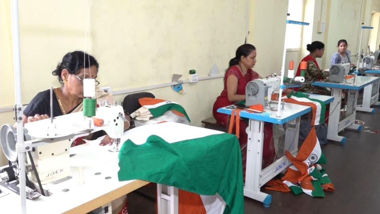 Women prepare the national flag
