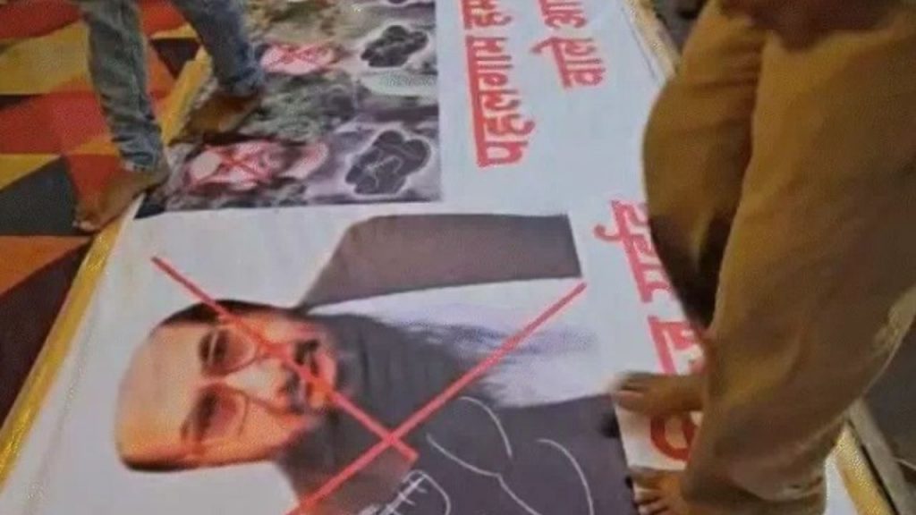 Posters of terrorists were trampled under feet in Ganesh pandal.