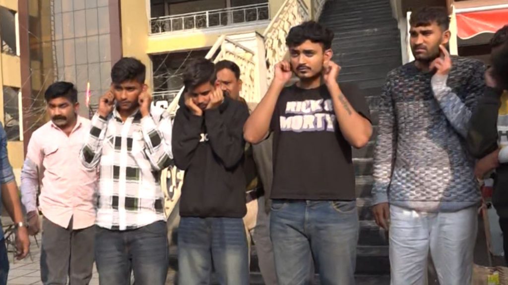 The police took out a procession of the miscreants who vandalized the cafe.