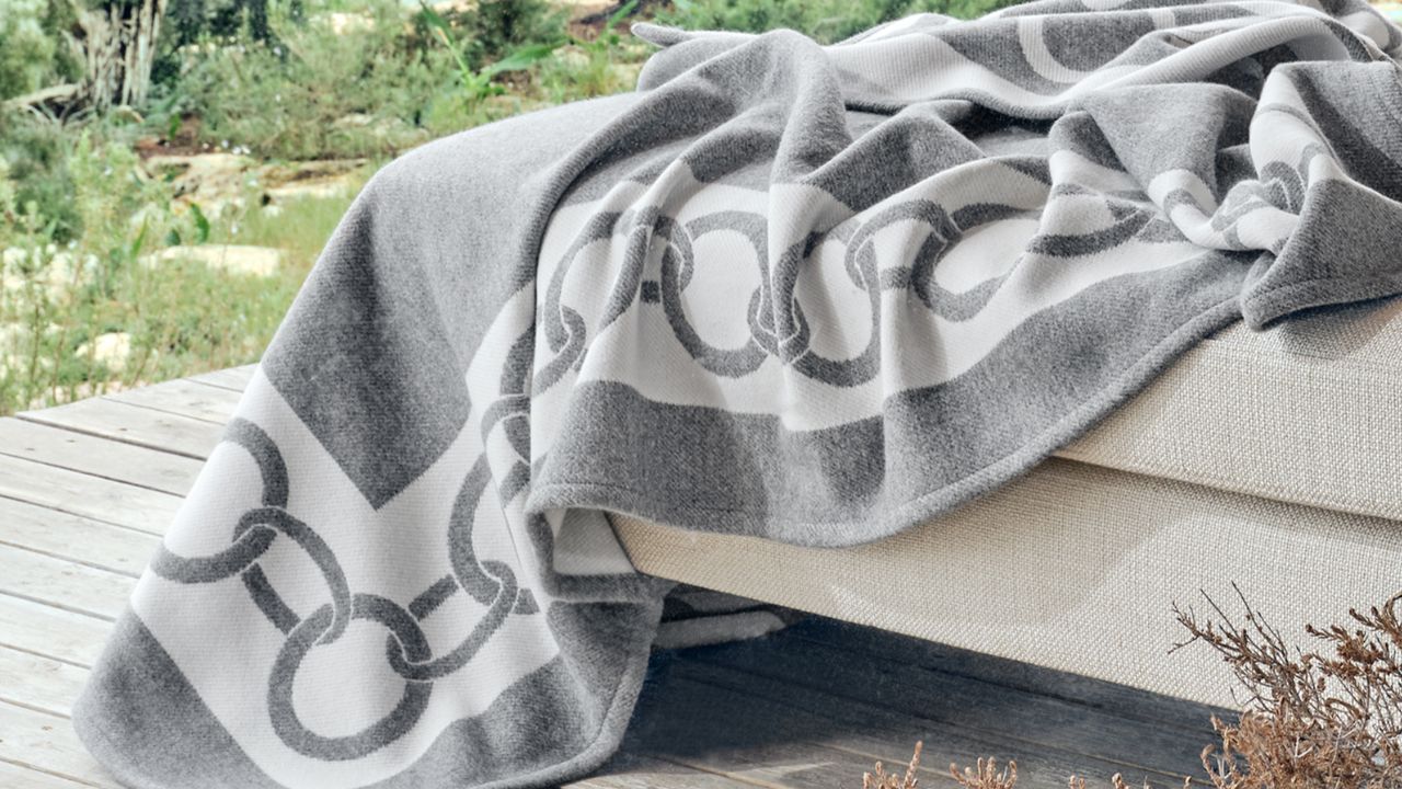 People buying blankets sold by weight in MP winter market