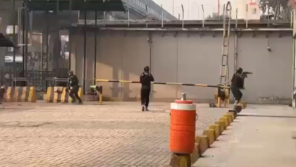 Pakistan double blast scene with security forces investigating explosion site