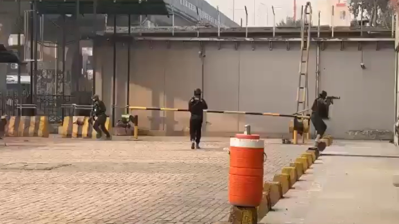 Pakistan double blast scene with security forces investigating explosion site