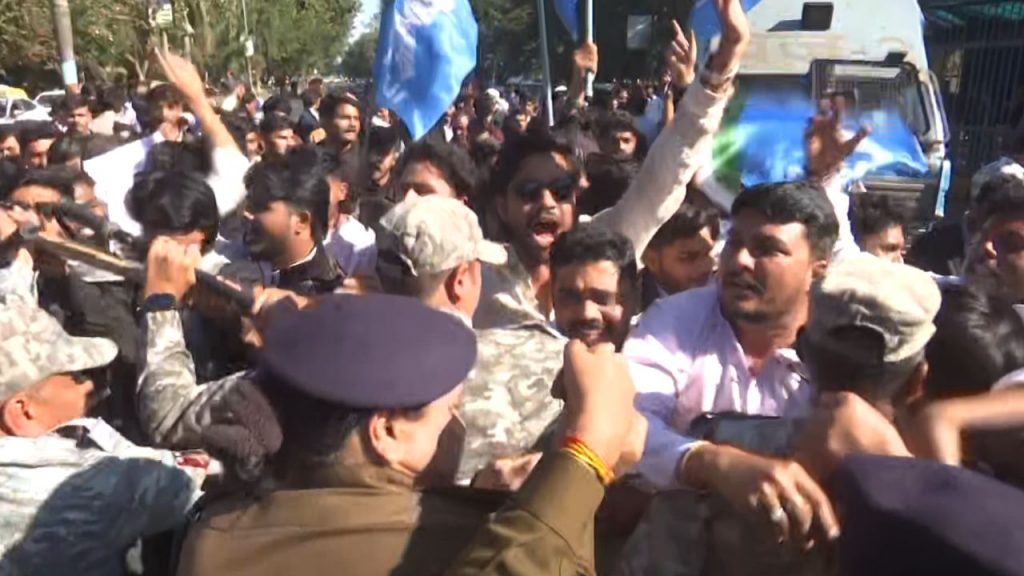 Clash between police and workers during NSUI protest.
