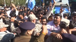 Clash between police and workers during NSUI protest.