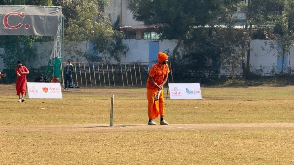 A player bats in a dhoti-kurta at a cricket tournament in Bhopal.