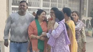 Family members crying after the student committed suicide.