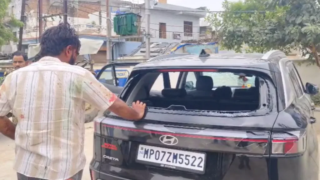 The car's windows were broken during the firing by the miscreants.