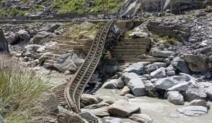 Dumper Falls While Crossing Bridge