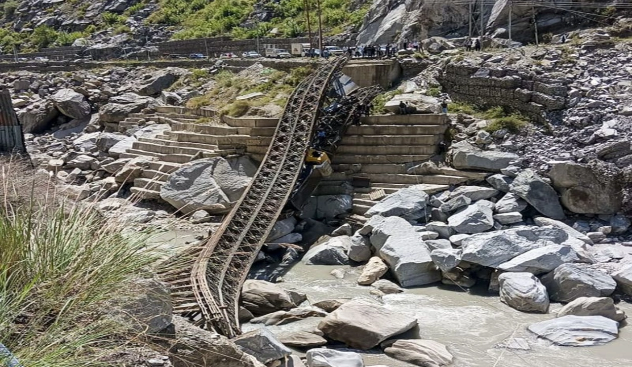 Dumper Falls While Crossing Bridge