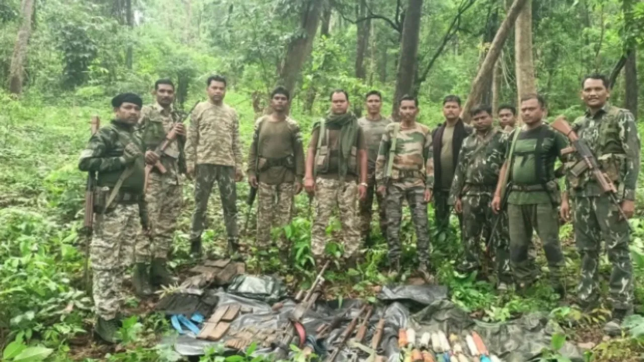 Security forces with a Naxal dump