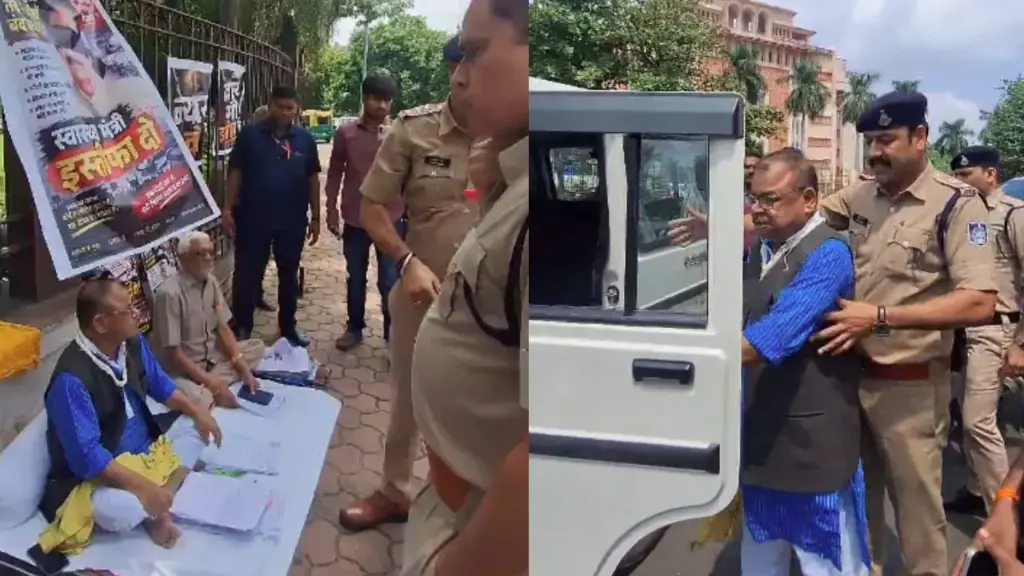 Police taking away Congress MLA Abhay Mishra.