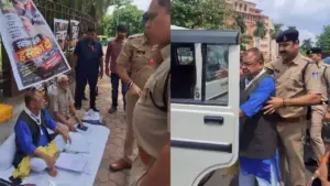 Police taking away Congress MLA Abhay Mishra.