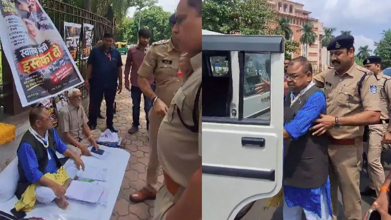 Police taking away Congress MLA Abhay Mishra.