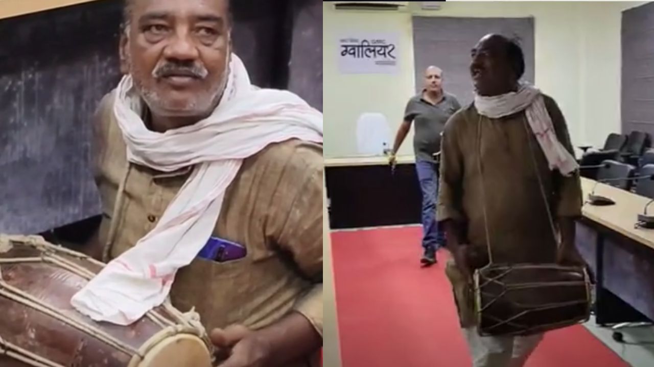 Former councilor arrives at public hearing with a dholak.