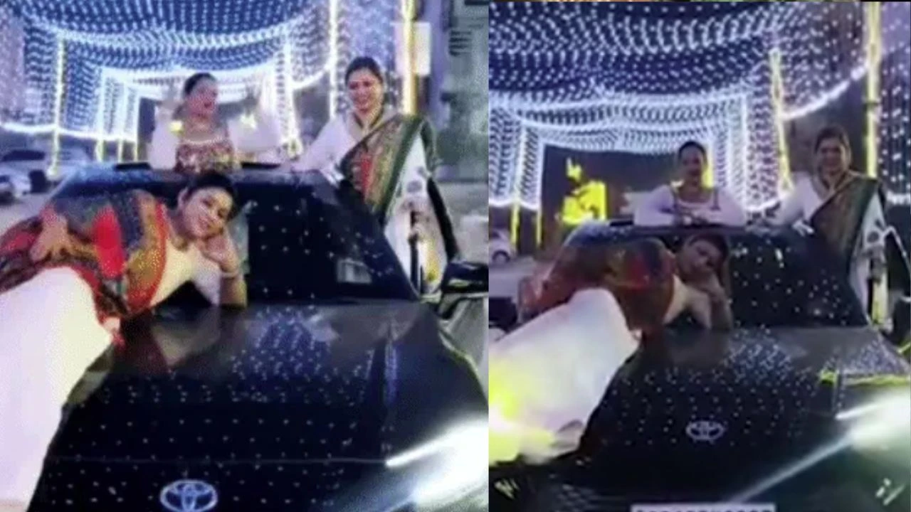 Young women performed stunts in a car.